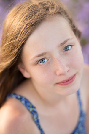 Close up photograph of girl in a field of flowers by Pueblo photographer K.D. Elise Photography