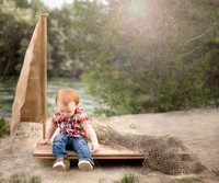 Pueblo Photographer K.D. Elise Photography's image of toddler boy on fishing raft