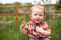 Toddler boy in grass at Pueblo Nature Center by professional photographer K.D. Elise Photography
