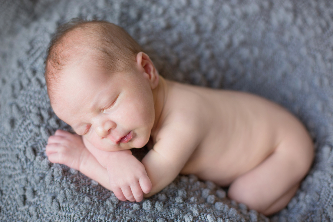 Sleeping ten day old newborn photographs by Pueblo photographer