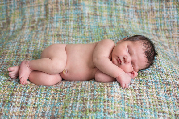 Pueblo newborn photography, eight day old sleeping baby boy.